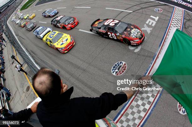Joey Logano, driver of the GameStop/Red Dead Redemption Toyota, leads the field at the start of the NASCAR Nationwide Series O'Reilly Auto Parts 300...