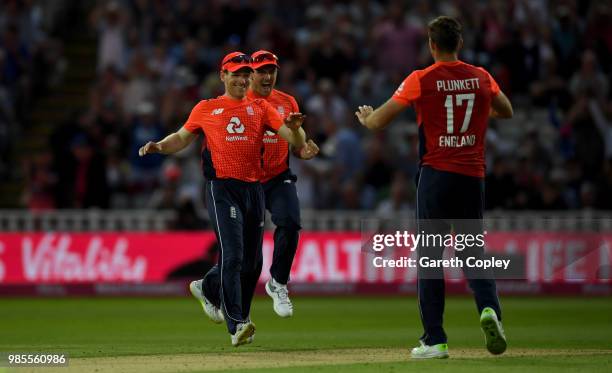 England captain Eoin Morgan celebrates with Jason Roy and Liam Plunkett after winning the Vitality International T20 between England and Australia at...