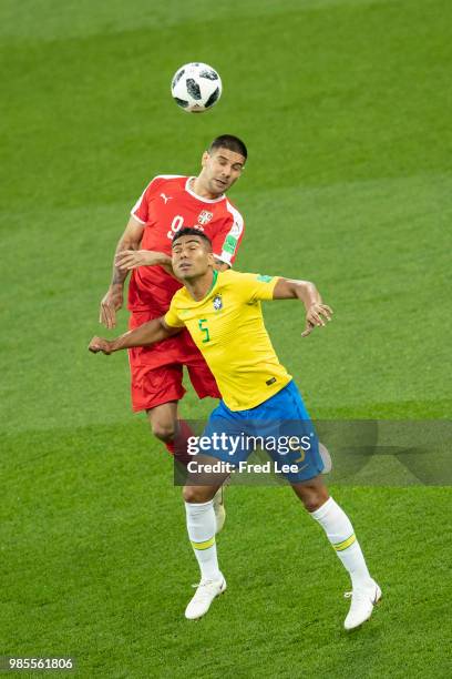 Casemiro of Brazil and Aleksandar Mitrovic of Serbia jump for a header during the 2018 FIFA World Cup Russia group E match between Serbia and Brazil...