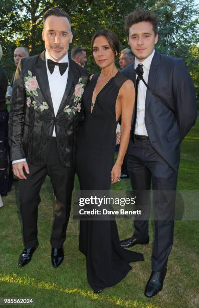 David Furnish, Victoria Beckham and Brooklyn Beckham attend the Argento Ball for the Elton John AIDS Foundation in association with BVLGARI & Bob and...