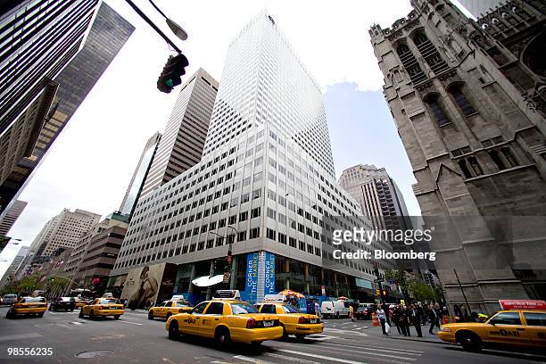 Traffic passes outside 666 Fifth Avenue in New York, U.S., on Monday, April 19, 2010. New York's Fifth Avenue is claiming a city retail record:...