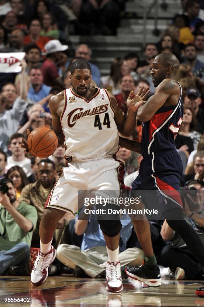 Leon Powe of the Cleveland Cavaliers makes a move against Joe Smith of the Atlanta Hawks during the game at Quicken Loans Arena on April 02, 2010 in...