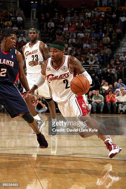 Mo Williams of the Cleveland Cavaliers drives to the basket against Joe Johnson of the Atlanta Hawks during the game at Quicken Loans Arena on April...