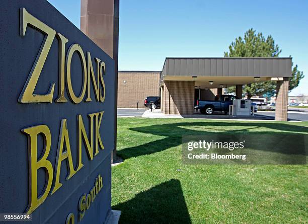 Customers use the drive through lane at a Zions Bank branch in Orem, Utah, U.S., on Monday, April 19, 2010. Zions Bancorporation, the best-performing...