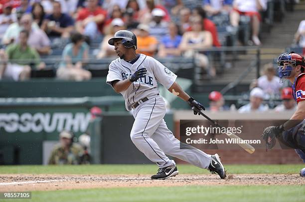 Chone Figgins of the Seattle Mariners bats and runs to first base from the batter's box during the game against the Texas Rangers at Rangers Ballpark...