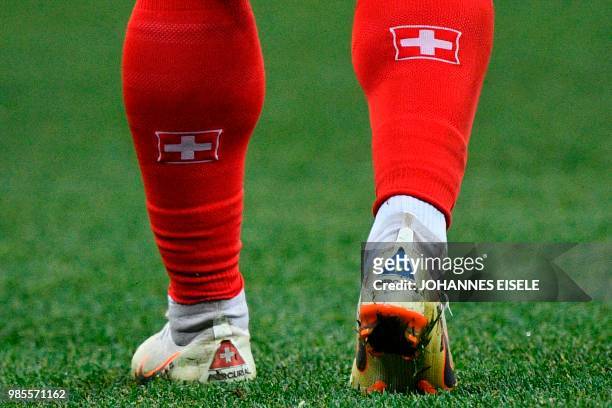 Picture shows the Switzerland and the Kosovo flag on the shoes of Switzerland's forward Xherdan Shaqiri prior to the Russia 2018 World Cup Group E...