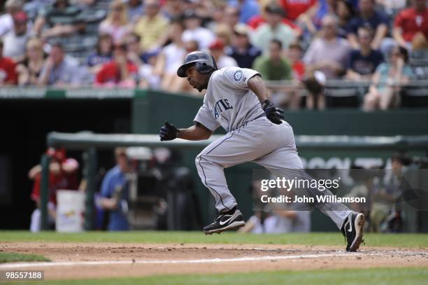 Chone Figgins of the Seattle Mariners bats and runs to first base from the batter's box during the game against the Texas Rangers at Rangers Ballpark...