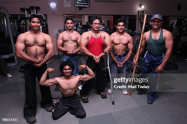 Joginder Singh aka Bittu poses in his gym, which he runs for disabled men in New Delhi on April 15, 2010. Singh who suffers from Polio is a dedicated...