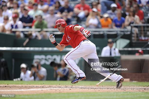 Michael Young of the Texas Rangers bats and runs to first base from the batter's box during the game against the Seattle Mariners at Rangers Ballpark...