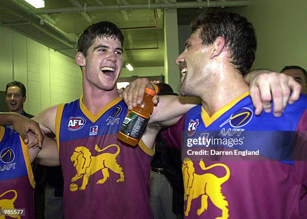 Jonathan Brown of Brisbane celebrates winning with his team mate Darryl White against Geelong during the round six AFL match between the Brisbane...