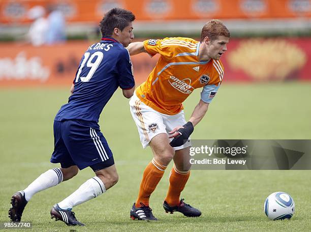 Andrew Hainult of the Houston Dynamo and Jorge Flores of Chivas USA fight for the ball at Robertson Stadium on April 17, 2010 in Houston, Texas.