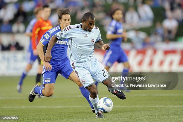 Marvell Wynne of the Colorado Rapids plays the ball into play under pressure from Josh Wolff of the Kansas City Wizards during their MLS match on...