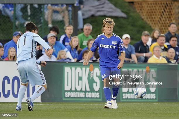 Michael Harrington of the Kansas City Wizards plays the ball under pressure from Colin Clark of the Colorado Rapids during their MLS match on April...