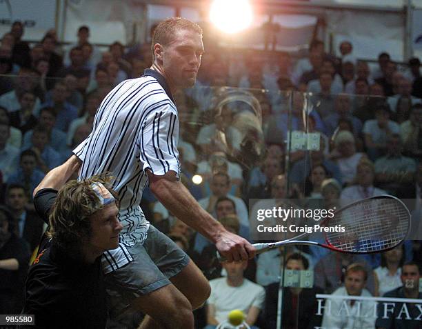 David Palmer of Australia [right] takes a tumble with Jonathon Power of Canada during their semi-final match in the Halifax Equitable Super Squash...