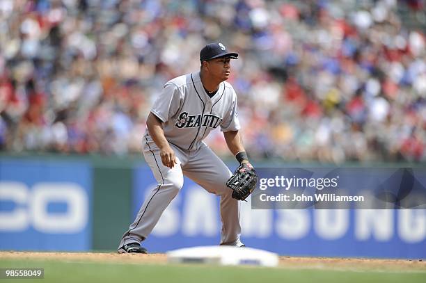 Third baseman Jose Lopez of the Seattle Mariners looks to home plate for the pitch from his position in the field during the game against the Texas...