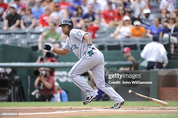 Jose Lopez of the Seattle Mariners bats and runs to first base from the batter's box during the game against the Texas Rangers at Rangers Ballpark in...