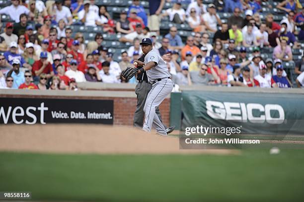 Third baseman Jose Lopez of the Seattle Mariners fields his position as he throws to first base after catching a ground ball during the game against...