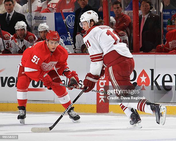 Martin Hanzal of the Phoenix Coyotes tries to skate past Valtteri Filppula of the Detroit Red Wings during Game Three of the Eastern Conference...