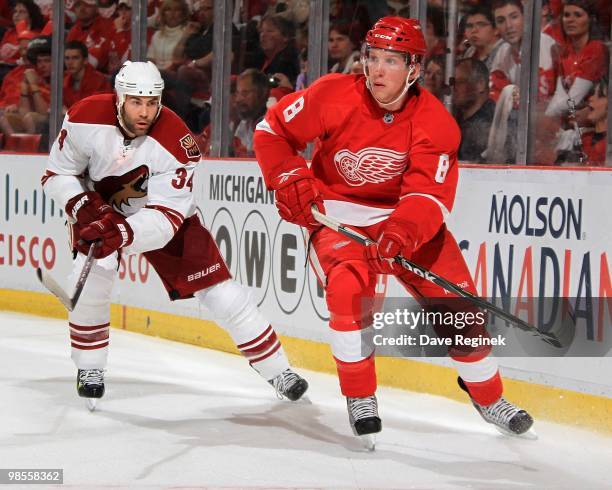 Justin Abdelkader of the Detroit Red Wings makes a pass in front of Daniel Winnik of the Phoenix Coyotes during Game Three of the Eastern Conference...