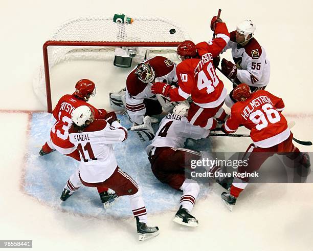 Ilya Bryzgalov, Ed Jovanovski, Zbynek Michalek and Martin Hanzal of the Phoenix Coyotes defend the net against Pavel Datsyuk, Henrik Zetterberg and...