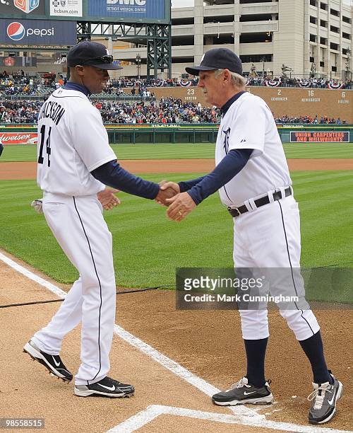Austin Jackson and manager Jim Leyland of the Detroit Tigers shake hands during player introductions before the Opening Day game against the...