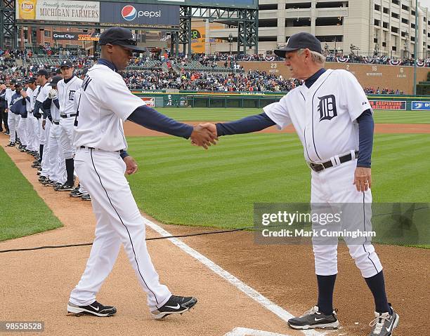 Austin Jackson and manager Jim Leyland of the Detroit Tigers shake hands during player introductions before the Opening Day game against the...