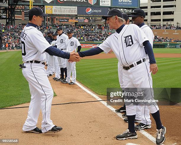 Magglio Ordonez and manager Jim Leyland of the Detroit Tigers shake hands during player introductions before the Opening Day game against the...