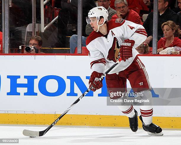 Zbynek Michalek of the Phoenix Coyotes turns up ice with the puck against the Detroit Red Wings during Game Three of the Eastern Conference...