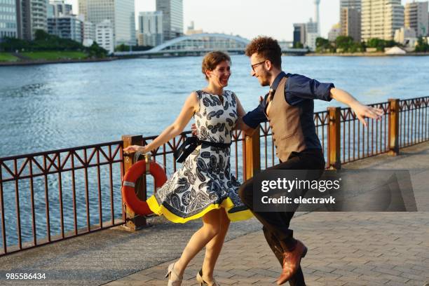 swing dancers at sunset - jive dancing stock pictures, royalty-free photos & images