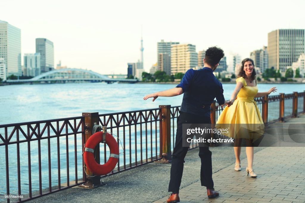 Swing dancers at sunset