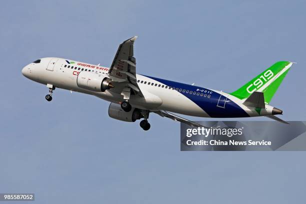 China's first domestically made C919 passenger jet takes off from the Shanghai Pudong International Airport for a test flight on June 26, 2018 in...