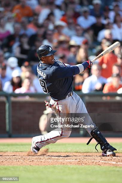 Yunel Escobar of the Atlanta Braves hitting during the game against the San Francisco Giants on Opening Day at AT&T in San Francisco, California on...