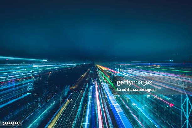 abstract blurred view of victoria harbor skyline - abstract city lights stock pictures, royalty-free photos & images