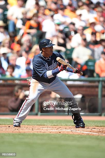 Yunel Escobar of the Atlanta Braves bunting during the game against the San Francisco Giants on Opening Day at AT&T in San Francisco, California on...