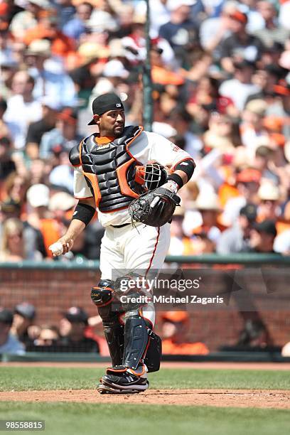 Bengie Molina of the San Francisco Giants catching during the game against the Atlanta Braves on Opening Day at AT&T in San Francisco California on...