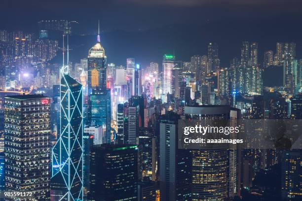 modern illuminated buildings in hong kong - central plaza hong kong stock-fotos und bilder