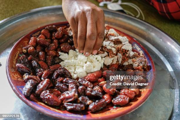 Dish of dates and cream are served for lunch in Ouadane, Mauritania. The city is famous for being a trading post in the desert with many libraries...