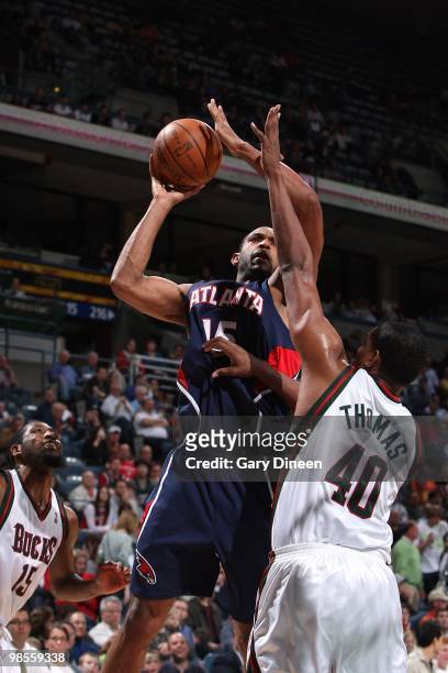 Al Horford of the Atlanta Hawks shoots against Kurt Thomas of the Milwaukee Bucks during the game on April 12, 2010 at the Bradley Center in...