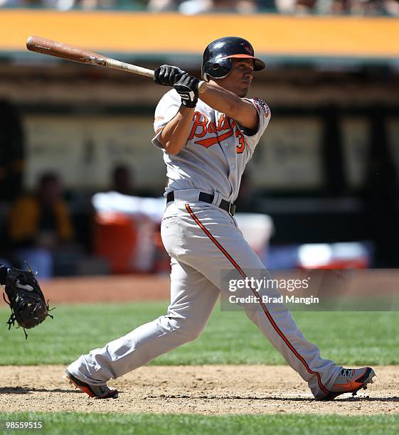 Cesar Izturis of the Baltimore Orioles bats against the Oakland Athletics during the game at the Oakland-Alameda County Coliseum on April 18, 2010 in...