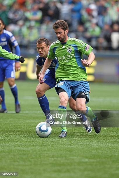 Pat Noonan of the Seattle Sounders FC battles Jack Jewsbury of the Kansas City Wizards on April 17, 2010 at Qwest Field in Seattle, Washington.