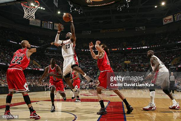 LeBron James of the Cleveland Cavaliers goes up for the basket surrounded by Taj Gibson, Luol Deng and Joakim Noah of the Chicago Bulls in Game Two...