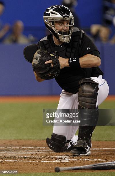 John Buck of the Toronto Blue Jays guards home plate against the Los Angeles Angels of Anaheim during a MLB game at the Rogers Centre April 18, 2010...