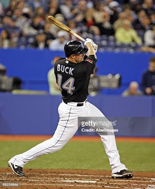 John Buck of the Toronto Blue Jays hits against Los Angeles Angels of Anaheim during a MLB game at the Rogers Centre April 18, 2010 in Toronto,...