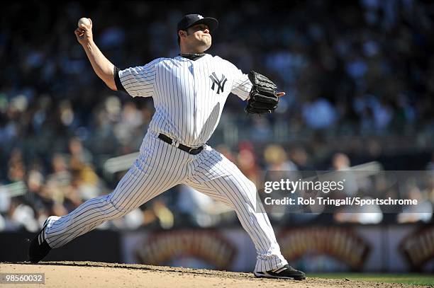 Joba Chamberlain of the New York Yankees pitches against the Los Angeles Angels of Anaheim at Yankee Stadium on April 14, 2010 in the Bronx borough...