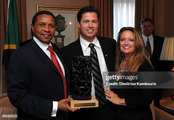 President Jakaya Kikwete presents Goodwill Ambassador Doug Pitt and Lisa Pitt with gifts during the Tanzania Education Trust New York Gala hosted by...