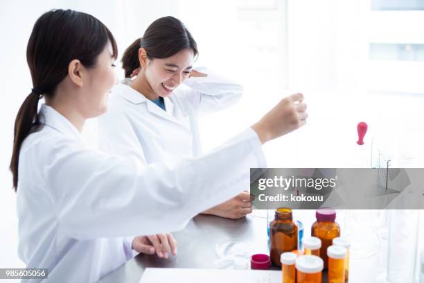 a state of a white woman's woman is experimenting. - reagent stock pictures, royalty-free photos & images