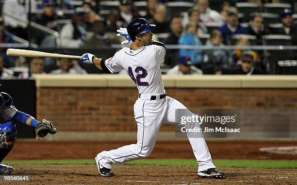 Angel Pagan of the New York Mets follows through on a seventh inning two run home run against the Chicago Cubs on April 19, 2010 at Citi Field in the...