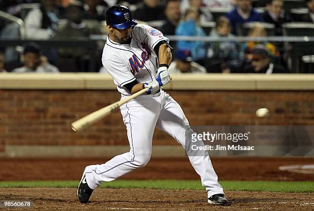 Angel Pagan of the New York Mets connects on a seventh inning two run home run against the Chicago Cubs on April 19, 2010 at Citi Field in the...