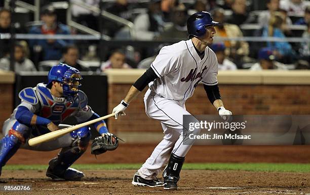 Ike Davis of the New York Mets hits a seventh inning RBI single against the Chicago Cubs on April 19, 2010 at Citi Field in the Flushing neighborhood...
