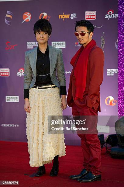 Chinese actress and singer Li Yuchun and Hong Kong actor Nicholas Tse arrive at the 29th Hong Kong Film Awards at the The Hong Kong Cultural Centre...